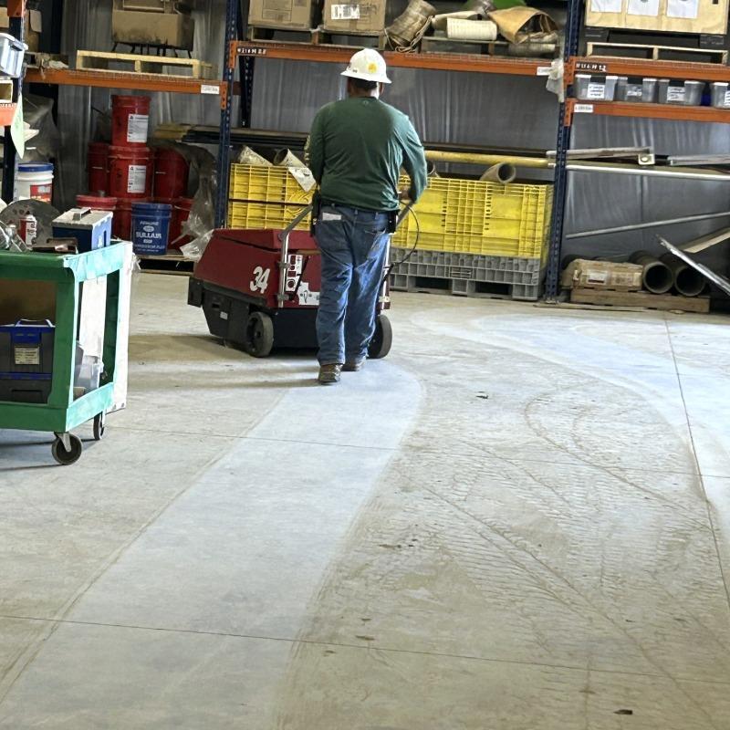 FactoryCat Walk Behind Floor Sweepers 34 warehouse concrete - https://assets.factorycat.com/demoImages/2025/april/34-Walk Behind Floor Sweepers-warehouse-concrete-San Antonio-USA-386.jpg - 800 - 800 - 386 A FactoryCat 34 battery floor sweeper cleaning a warehouse's concrete floor of a general contractor in San Antonio, TX