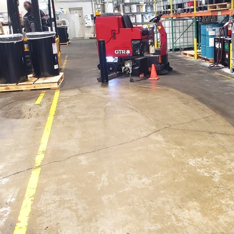 FactoryCat Ride On Floor Scrubbers GTR garage concrete - https://assets.factorycat.com/demoImages/2025/april/GTR-Ride On Floor Scrubbers-garage-concrete-Miami-USA-640.jpg - 800 - 800 - 640 GTR Ride On Floor Scrubber cleaning the concrete floor in a maintenance garage a a university in Miami, Florida