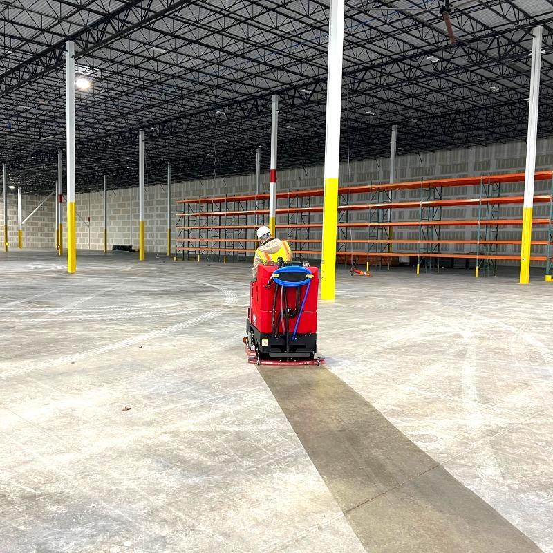 FactoryCat Ride On Floor Scrubbers GTR warehouse concrete - https://assets.factorycat.com/demoImages/2025/april/GTR-Ride On Floor Scrubbers-warehouse-concrete-St. Paul-USA-399.jpg - 800 - 800 - 399 A GTR battery ride on floor scrubber performing new construction clean up of a warehouse concrete floor in St. Paul, MN