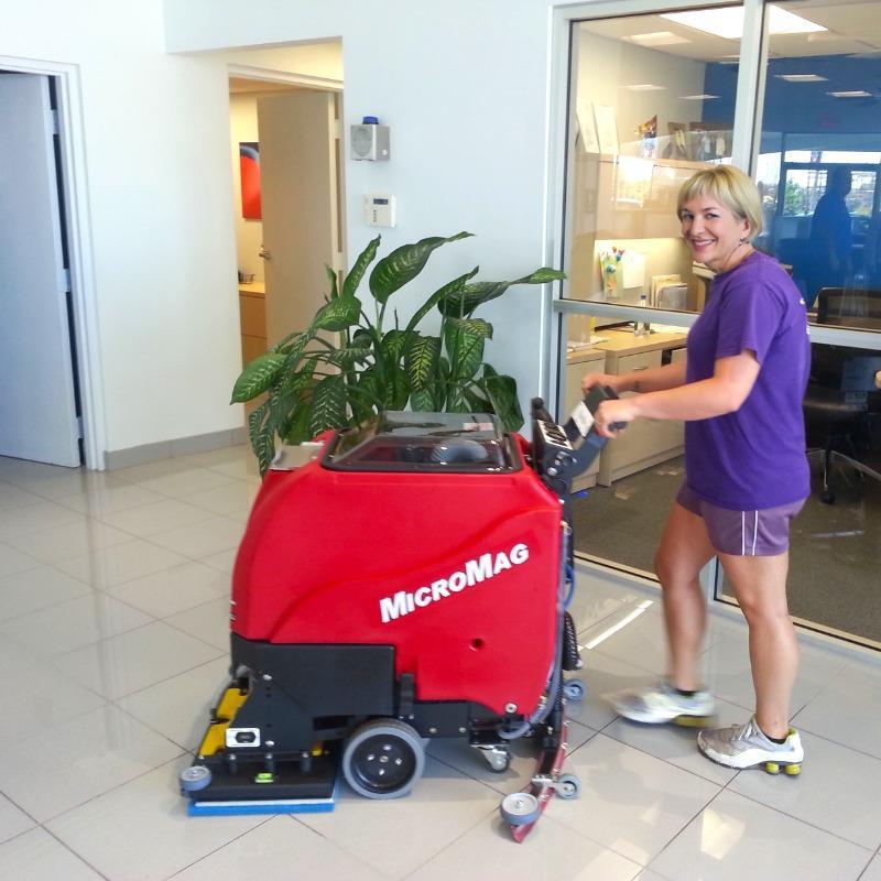 FactoryCat Walk Behind Floor Scrubbers MicroMag showroom tile floors - https://assets.factorycat.com/demoImages/2025/april/MicroMag-Walk Behind Floor Scrubbers-showroom-tile floors-Reno-USA-751.jpg - 800 - 800 - 751 MicroMag Walk Behind Floor Scrubber cleaning the tile floor in a showroom of a Reno, Nevada auto dealer.