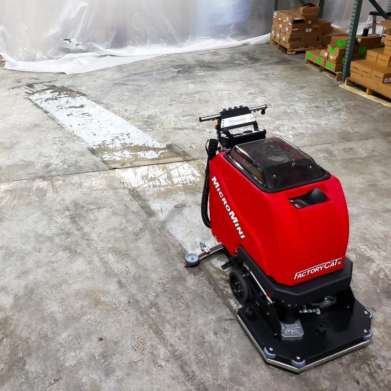 FactoryCat Walk Behind Floor Scrubbers MicroMini stockroom epoxy - https://assets.factorycat.com/demoImages/2025/april/MicroMini-Walk Behind Floor Scrubbers-stockroom-epoxy-Harrisburg-USA-874.jpg - 800 - 800 - 874 FactoryCat MicroMini Walk Behind Floor Scrubber cleans the epoxy floor of a stockroom in a Harrisburg, Pennsylvania hardware store