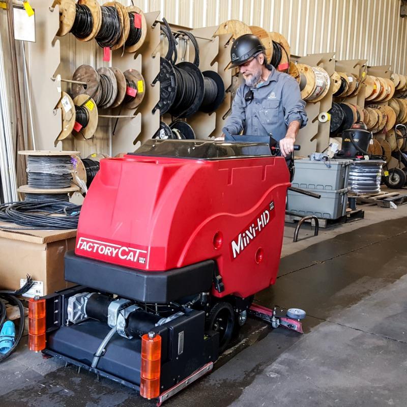 FactoryCat Walk Behind Floor Scrubbers Mini-HD maintenance shop concrete - https://assets.factorycat.com/demoImages/2025/april/Mini-HD-Walk Behind Floor Scrubbers-maintenance shop-concrete-Pittsburg-USA-560.jpg - 800 - 800 - 560 FactoryCat Mini-HD Walk Behind Floor Scrubbers cleans the concrete floor at a foundry in Pennsylvania