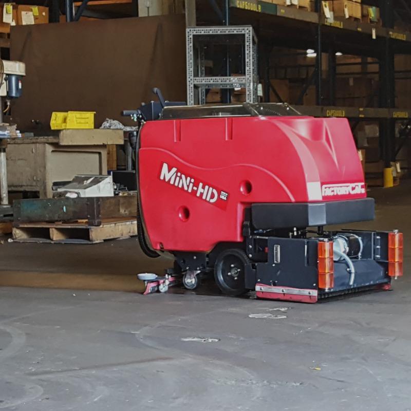 FactoryCat Walk Behind Floor Scrubbers Mini-HD warehouse concrete - https://assets.factorycat.com/demoImages/2025/april/Mini-HD-Walk Behind Floor Scrubbers-warehouse-concrete-Pittsburg-USA-548.jpg - 800 - 800 - 548 FactoryCat Mini-HD Walk Behind Floor Scrubbers cleans the concrete warehouse floor at a foundry in Pennsylvania